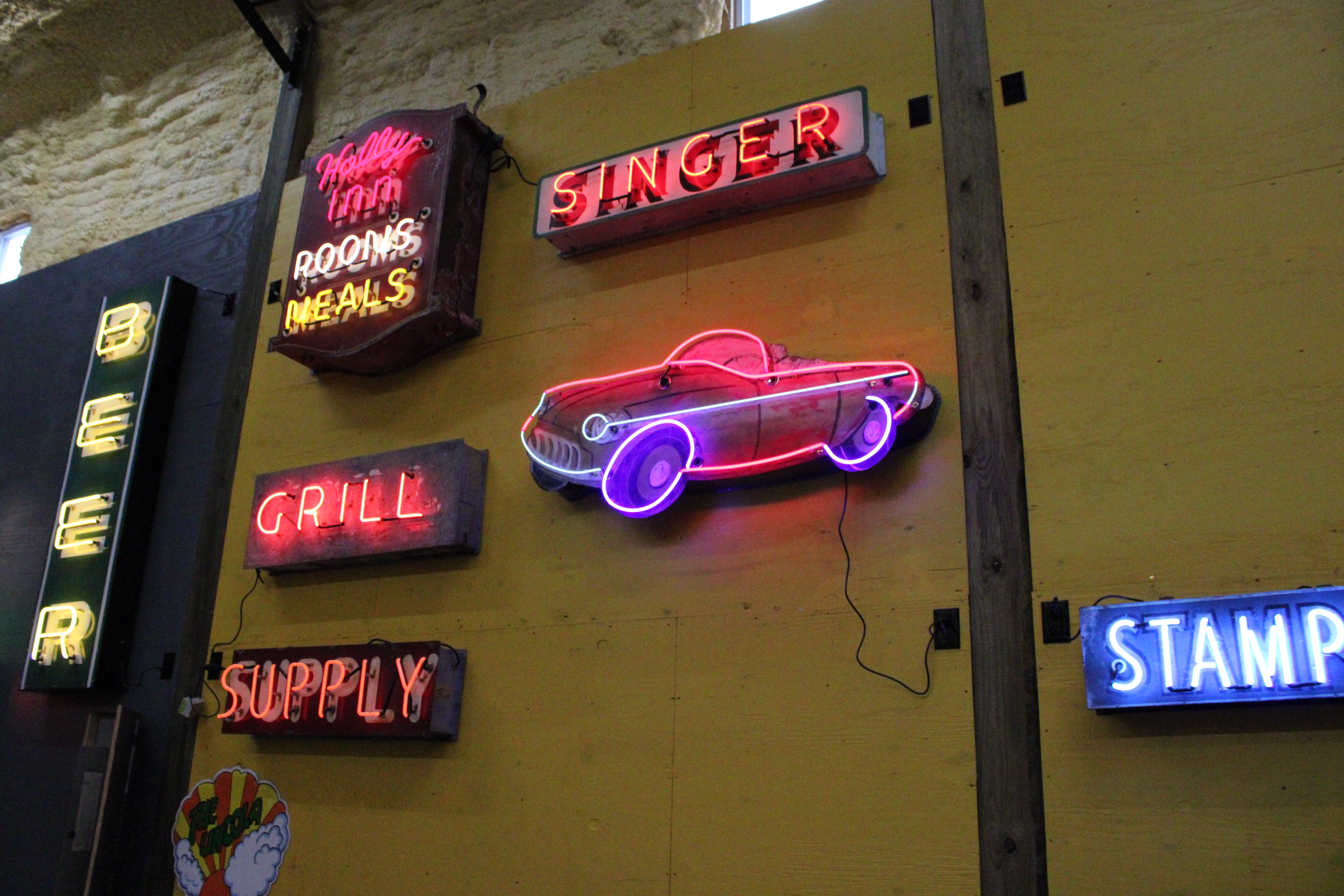 Liquid Fire shop wall with multiple signs